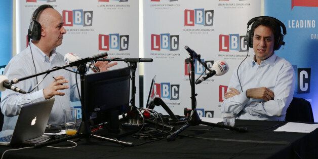 Leader of the Labour Party Ed Miliband taking part in live phone-in on the LBC national commercial news talk station with presenter Iain Dale (left)
