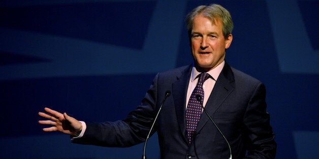 Owen William Paterson, Secretary of State for Environment, Food and Rural Affairs speaks during the Conservative Party Conference in Manchester, north -west England on September 30, 2013. Britons who are out of work for several years will be required to work full-time on community projects to receive state unemployment payments, finance minister George Osborne will announce at the party's annual conference in Manchester, northwest England, in a bid to woo traditional conservative voters ahead o