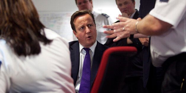 LONDION - OCTOBER 10: Prime Minister David Cameron talks to UK border agency officials in their control room during a visit to Heathrow terminal 5, on October 10, 2011 in London, England. Cameron's visit to the airport comes ahead of his talk on immigration controls. (Photo by Richard Pohle - WPA Pool/Getty Images)