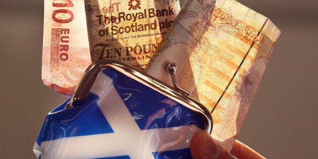 A posed photo of an Euro, a Royal Bank of Scotland and a Bank of England note being pulled from a Saltire purse in Edinburgh, Scotland. Scotland's First Minister Alex Salmond said today that he was ready to meet Prime Minister David Cameron "in Edinburgh, in London or wherever" to discuss the way forward for a referendum on independence.