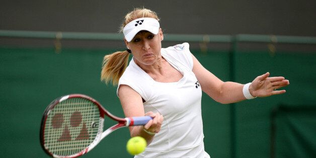 LONDON, ENGLAND - JUNE 24: Elena Baltacha of Great Britain hits a forehand during the Ladies Singles match against Flavia Pennetta of Italy on day one of the Wimbledon Lawn Tennis Championships at the All England Lawn Tennis and Croquet Club on June 24, 2013 in London, England. (Photo by Dennis Grombkowski/Getty Images)