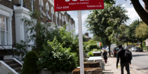 LONDON, ENGLAND - JUNE 03: An estate agent sold sign is displayed outside a property on June 3, 2014 in London, England. Figures from the Nationwide, the UK's largest building society, have shown that in the year to May, the annual rise in house prices was 11.1% which represents the greatest rate of increase in seven years. (Photo by Oli Scarff/Getty Images)