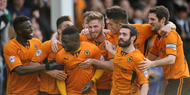 Wolves won 3-0 at Walsall to move up to first