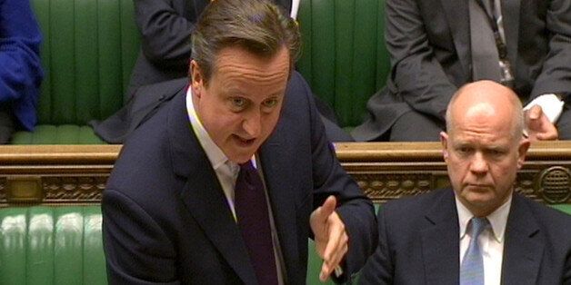 Prime Minister David Cameron reads a statement in the House of Commons, London, regarding the crisis in Ukraine.