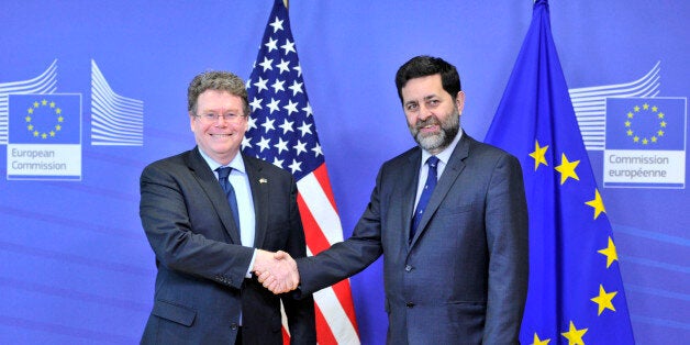 EU chief negotiator Ignacio Garcia Bercero (R) and US chief negotiator Dan Mullaney (L) pose on March 10,2014 at the EU Headquarters in Brussels. A fourth round of EU-US trade talks will kick off in Brussels to day. The talks will help pave the way for a future trade and investment deal, known as the Transatlantic Trade and Investment Partnership, or TTIP. Negotiators will discuss different aspects of the agreement, including trade in services, public procurement, rules of origin, technical barr