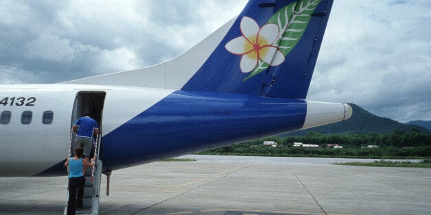 LUANG PRABANG, LAOS - 2004/06/29: Passengers board a Lao Airlines flight from Luang Prabang to Chiang Mai.. (Photo by Jerry Redfern/LightRocket via Getty Images)