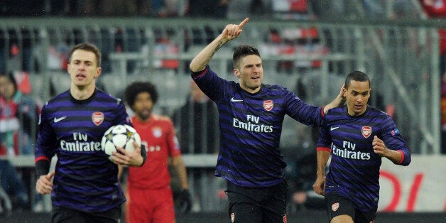 MUNICH, GERMANY - MARCH 13: Olivier Giroud (2ndR) celebrates scoring the 1st Arsenal goal with Theo Walcott (R) during the UEFA Champions League Round of 16 second leg match between Bayern Muenchen and Arsenal FC at Allianz Arena on March 13, 2013 in Munich, Germany. (Photo by Stuart MacFarlane/Arsenal FC via Getty Images)