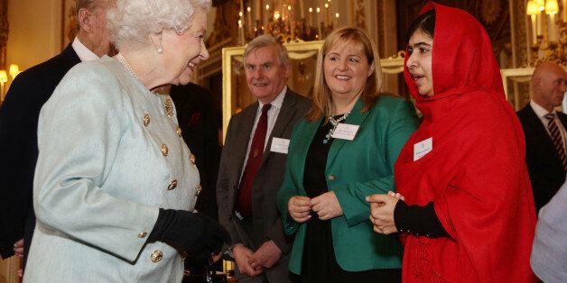 Queen Elizabeth II meeting Malala Yousafzai during a Reception for Youth, Education and the Commonwealth at Buckingham Palace, London.