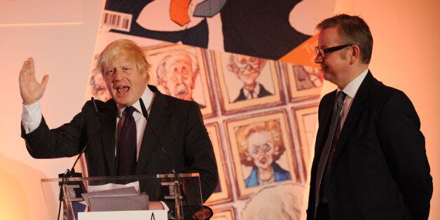 London Mayor Boris Johnson collects his award for Politician of the Year as Education Secretary Michael Gove looks on at this year's Spectator Magazine's Parliamentarian of the Year Awards, in central London.