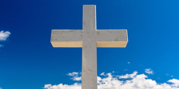 white cross against blue sky...