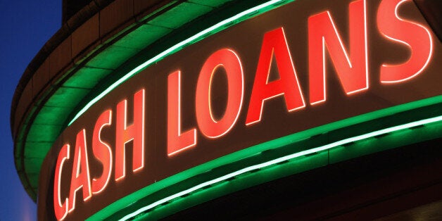 LONDON, ENGLAND - NOVEMBER 01: A sign outside a 'Speedy Cash' cash loans shop on Brixton High Street on November 1, 2012 in London, England. The recession has changed the face of the UK's high streets, which have seen a boom in bookmakers, discount stores, charity shops, cheque cashing (payday loans) and pawnbrokers as cash-strapped Brits struggled with their finances. (Photo by Dan Kitwood/Getty Images)