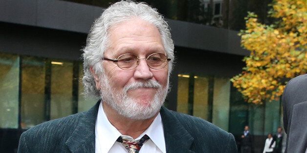 LONDON, ENGLAND - OCTOBER 22: Former Radio One disc jockey Dave Lee Travis arrives at Southwark Crown Court on October 22, 2013 in London, England. Mr Travis' lawyers are attempting to reduce the number of charges he faces in connection with allegations of indecent and sexual assault. (Photo by Peter Macdiarmid/Getty Images)