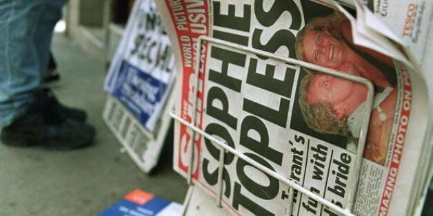 LONDON, UNITED KINGDOM - MAY 26: A newspaper stand displays a copy of the British tabloid newspaper 'The Sun' which ran on its Page 3, normally reserved for pictures of topless models, a topless photograph of Royal bride-to-be Sophie Rhys-Jones, 26 May 1999. The revealing picture, taken in 1988, shows Sophie with a British DJ, Chris Tarrant whilst on a Capital Radio tour in Malaga and has caused outrage here amongst Buckingham Palace. The woman who sold the picture was Today sacked from her jo