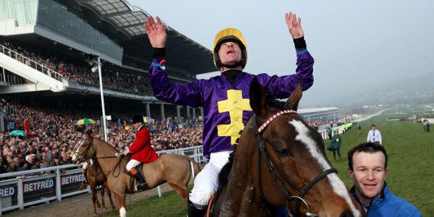 CHELTENHAM, ENGLAND - MARCH 13: Davy Russell riding Lord Windermere win The RSA Steeple Chase during Ladies Day at Cheltenham racecourse on March 13, 2013 in Cheltenham, England. (Photo by Alan Crowhurst/Getty Images)