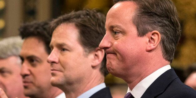 (left to right) Labour leader Ed Miliband, Deputy Prime Minister Nick Clegg and Prime Minister David Cameron listening to a speech by German Chancellor Angela Merkel in the Royal Gallery of the House of Lords in London.