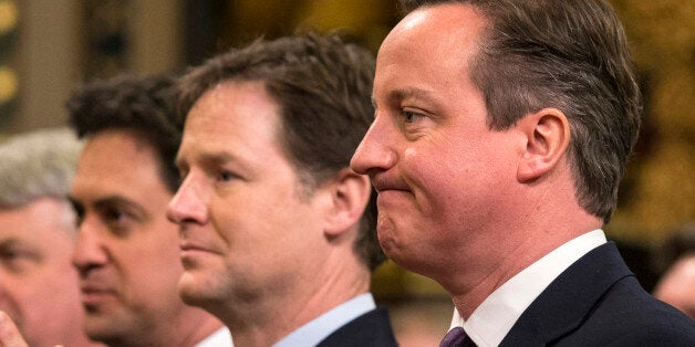 (left to right) Labour leader Ed Miliband, Deputy Prime Minister Nick Clegg and Prime Minister David Cameron listening to a speech by German Chancellor Angela Merkel in the Royal Gallery of the House of Lords in London.