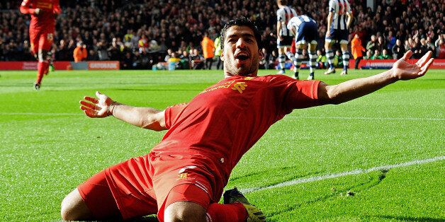 LIVERPOOL, ENGLAND - OCTOBER 26: ( THE SUN OUT, THE SUN ON SUNDAY OUT) Luis Suarez of Liverpool celebrates his first goal during the Barclays Premier League match between Liverpool and West Bromwich Albion at Anfield on October 26, 2013 in Liverpool, England. (Photo by Andrew Powell/Liverpool FC via Getty Images)
