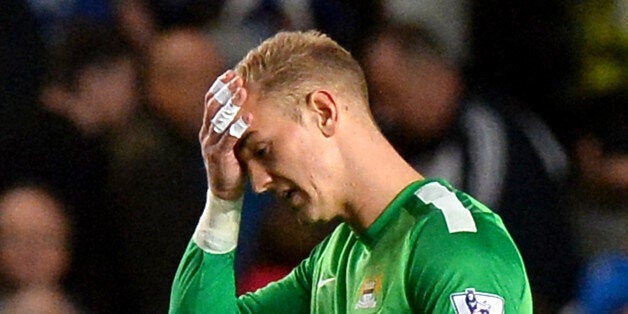 Manchester City's English goalkeeper Joe Hart reacts as he leaves the pitch during the English Premier League football match between Chelsea and Manchester City at Stamford Bridge in west London on October 27, 2013. AFP PHOTO/BEN STANSALLRESTRICTED TO EDITORIAL USE. No use with unauthorized audio, video, data, fixture lists, club/league logos or live services. Online in-match use limited to 45 images, no video emulation. No use in betting, games or single club/league/player publications. (Photo credit should read BEN STANSALL/AFP/Getty Images)