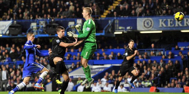 Manchester City's Serbian defender Matija Nastasic (2nd L) heads the ball back past his own goalkeeper Manchester City's English goalkeeper Joe Hart (3rd L), allowing Chelsea's Spanish striker Fernando Torres (L) to score the winning goal of the English Premier League football match between Chelsea and Manchester City at Stamford Bridge in west London on October 27, 2013. Chelsea won the game 2-1. AFP PHOTO/GLYN KIRKRESTRICTED TO EDITORIAL USE. No use with unauthorized audio, video, data, fixtur
