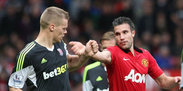 MANCHESTER, ENGLAND - OCTOBER 26: Robin van Persie of Manchester United clashes with Ryan Shawcross of Stoke City during the Barclays Premier League match between Manchester United and Stoke City at Old Trafford on October 26, 2013 in Manchester, England. (Photo by Matthew Peters/Man Utd via Getty Images)