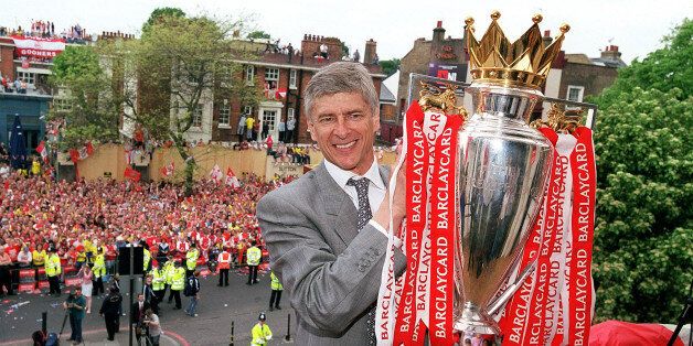 LONDON, ENGLAND - MAY 19: Arsenal manager Arsene Wenger holds the Premier League trophy at Islington Town Hall on May 19, 2004 in London, England. (Photo by Stuart MacFarlane/Arsenal FC via Getty Images)