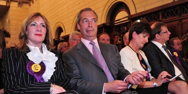 UK Independence Party (UKIP) leader Nigel Farage (2L) sits with fellow UKIP candidates Janice Atkinson (L), Diane James (2R) and Ray Finch (R) as the South East England region results of the European Parliament elections are declared by the returning officer at Southampton Guildhall in Southampton, southern England, on May 25, 2014. Results rolled in for the European Parliament elections with all eyes on potential gains by Europe's increasingly popular anti-EU parties. Farage, leader of the euro