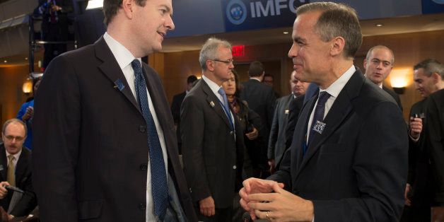 Governor of the Bank of England Mark Carney (R) talks with British Finance Minister George Osborne (L) during annual IMF/World Bank meetings in Washington, DC, October 12, 2013. AFP PHOTO / Jim WATSON (Photo credit should read JIM WATSON/AFP/Getty Images)