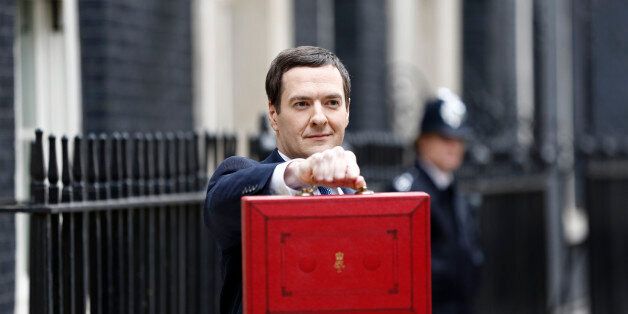 George Osborne, U.K. chancellor of the exchequer, holds the dispatch box containing the 2014 budget as he stands outside 11 Downing Street in London, U.K., on Wednesday, March 19, 2014. Osborne will lay out a budget today focused on securing Britain's economic recovery and rebutting opposition Labour Party claims that he's ignoring the rising cost of living. Photographer: Simon Dawson/Bloomberg via Getty Images