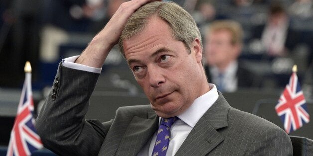 Leader of the UK Independence Party (UKIP) Nigel Farage attends a statement by the centre-right European People's Party (EPP) group candidate designate for the presidency of the European Commission on July 15, 2014 in the European Parliament in Strasbourg, eastern France. The EU's newly-elected parliament decides on July 15 whether to name the EPP's Jean-Claude Juncker of Luxembourg as next head of the powerful European Commission, who called for a 300-billion-euro investment plan for Europe as