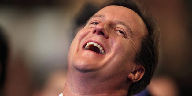 MANCHESTER, ENGLAND - OCTOBER 05: Conservative leader David Cameron laughs while he waits to address delegates at the Conservative Party Conference on October 5, 2009 in Manchester, England. Britain's Conservatives are meeting in Manchester this week for their final party conference before next year's general election. (Photo by Dan Kitwood/Getty Images)