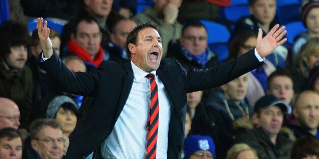 CARDIFF, WALES - DECEMBER 26: Malky Mackay, manager of Cardiff City shows his frustration during the Barclays Premier League match between Cardiff City and Southampton at Cardiff City Stadium on December 26, 2013 in Cardiff, Wales. (Photo by Christopher Lee/Getty Images)