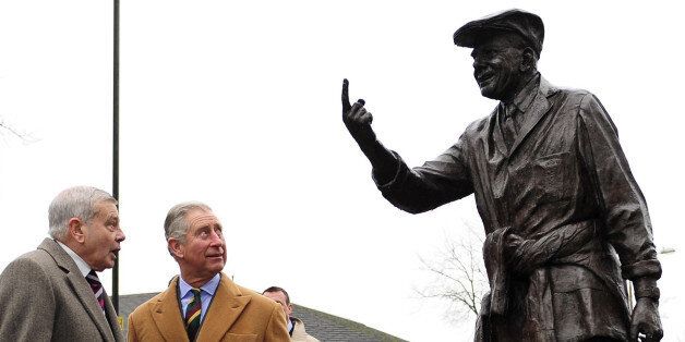 Britain's Prince Charles (2nd L) and former cricket umpire Dickie Bird (L) look at his statue in Barnsley in northern England, on January 24, 2012. Bird said he was 'humbled' to meet Prince Charles in his home town of Barnsley. He said the royal visitor discussed cricket and the current series against Pakistan in the United Arab Emirates which began with a crushing defeat for England. AFP PHOTO/John Giles/POOL (Photo credit should read JOHN GILES/AFP/Getty Images)