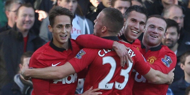 LONDON, ENGLAND - NOVEMBER 02: Robin van Persie (2nd R) of Manchester United celebrates scoring their second goal during the Barclays Premier League match between Fulham and Manchester United at Craven Cottage on November 2, 2013 in London, England. (Photo by Matthew Peters/Man Utd via Getty Images)