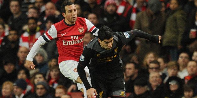 LONDON, ENGLAND - JANUARY 30: (THE SUN OUT, THE SUN ON SUNDAY OUT) Santi Cazorla of Arsenal brings down Luis Suarez of Liverpool during the Barclays Premier League match between Arsenal and Liverpool at Emirates Stadium on January 30, 2013 in London, England. (Photo by Andrew Powell/Liverpool FC via Getty Images)