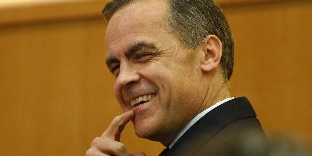 Bank of England Governor Mark Carney smiles as he waits to deliver his speech on 'One Mission. One Bank. Promoting the good of the people of the United Kingdom' at the Cass Business School in London, on March 18, 2014. AP PHOTO / SANG TAN/POOL (Photo credit should read SANG TAN/AFP/Getty Images)