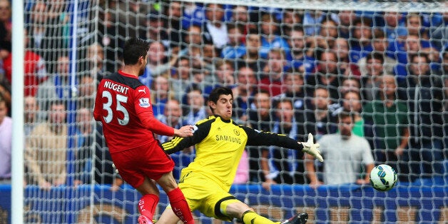 LONDON, ENGLAND - AUGUST 23: Thibaut Courtois of Chelsea saves from David Nugent of Leicester City during the Barclays Premier League match between Chelsea and Leicester City at Stamford Bridge on August 23, 2014 in London, England. (Photo by Paul Gilham/Getty Images)