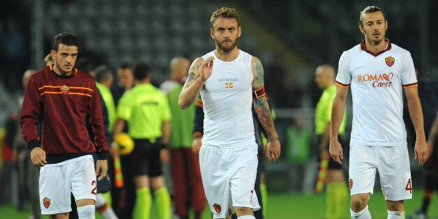 TURIN, ITALY - NOVEMBER 03: (L to R) Alessandro Florenzi, Daniele De Rossi and Federico Balzaretti of AS Roma look dejected at the end of the Serie A match between Torino FC and AS Roma at Stadio Olimpico di Torino on November 3, 2013 in Turin, Italy. (Photo by Valerio Pennicino/Getty Images)