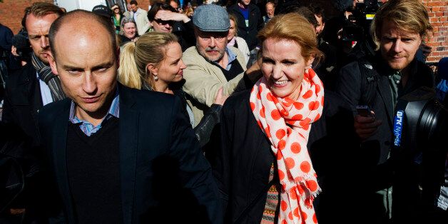 The leader of the Social Democrats, Helle Thorning-Schmidt (C) and her husband Stephen Kinnock (L) leave a polling station in a school in Copenhagen on September 15, 2011 after voting in the Danish general elections. Danes came out in droves to vote in a general election expected to bring the center-left back to power after a decade in opposition and deliver the country's first woman prime minister. AFP PHOTO / JONATHAN NACKSTRAND (Photo credit should read JONATHAN NACKSTRAND/AFP/Getty Images