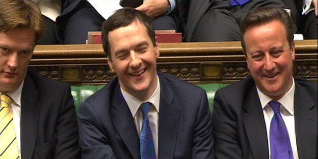 Chancellor of the Exchequer George Osborne laughs as Labour party leader Ed Miliband responds to his Budget statement to the House of Commons, London.