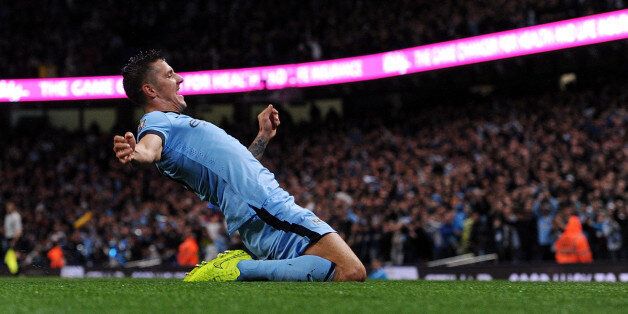 MANCHESTER, ENGLAND - AUGUST 25: (THE SUN OUT, THE SUN ON SUNDAY OUT) Stevan Jovetic of Manchester City celebrates after scoring the opening goal during the Barclays Premier Leauge match between Manchester City and Liverpool at Etihad Stadium on August 25, 2014 in Manchester, England. (Photo by John Powell/Liverpool FC via Getty Images)