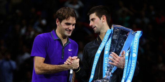 LONDON, ENGLAND - NOVEMBER 12: Novak Djokovic of Serbia shakes hands with Roger Federer of Switzerland as he holds the trophy following their men's singles final match against Roger Federer of Switzerland during day eight of the ATP World Tour Finals at O2 Arena on November 12, 2012 in London, England. (Photo by Julian Finney/Getty Images)