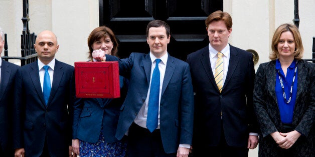 George Osborne leaves Downing Street before delivering his 2014 budget announcement at the House of Commons.