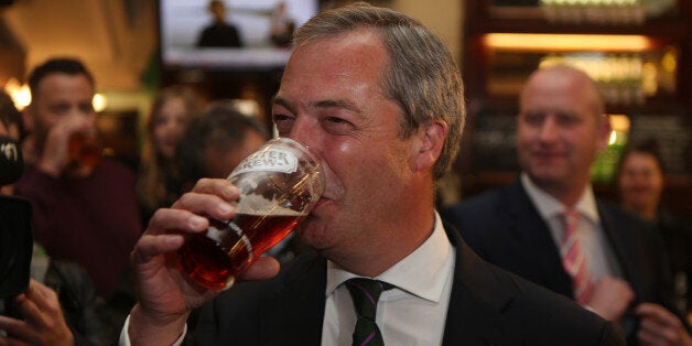 Ukip leader Nigel Farage has a pint in the Westminster Arms, London, as he celebrates his partys results in the polls for the European Parliament.