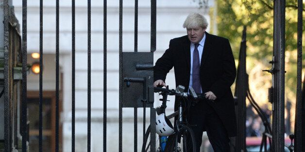 Mayor of London Boris Johnson walks through Downing Street on his way for the morning service of remembrance at the Cenotaph in Whitehall, London.
