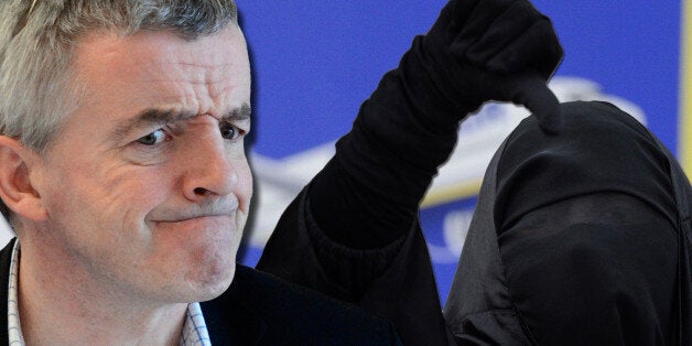 Low Cost airline Ryanair CEO Michael O'Leary reacts during a media conference outlining EU rules preventing EU staff from using budget airlines, in Brussels, Thursday, March 29, 2012. Ryanair is criticizing the European Union for allegedly discriminating against low-fare airlines and favoring national flag carriers. (AP Photo/Yves Logghe)