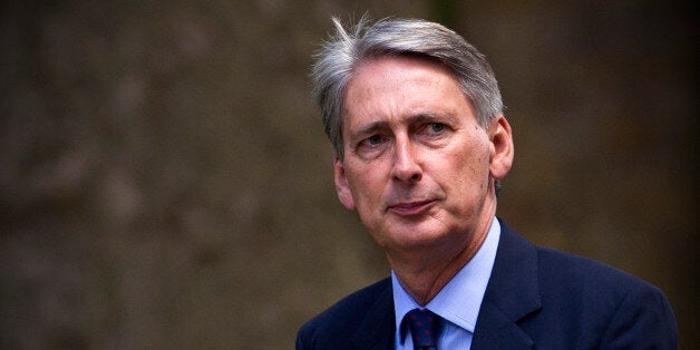 British Defence Secretary Philip Hammond arrives at Downing Street in central London on August 27, 2013. Britain's armed forces are drawing up contingency plans for military action in Syria, Prime Minister David Cameron's spokesman said on August 27, but no decision had been made about what action may be taken. Cameron will decide later on August 27 whether to recall parliament from its summer recess to debate a possible military intervention in the wake of a chemical weapons attack that Washington, London and Paris believe was carried out by the Syrian regime, Downing Street said. AFP PHOTO / CARL COURT (Photo credit should read CARL COURT/AFP/Getty Images)