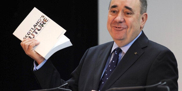 Scotland's First Minister Alex Salmond speaks during a press conference to launch his regional government's long-awaited 'white paper' ahead of next year's historic independence referendum, at Glasgow Science Centre in Glasgow, Scotland, on November 26, 2013. An independent Scotland would keep Queen Elizabeth II as its monarch but create its own defence force, nationalist leader Salmond said as he unveiled the detailed proposals. AFP PHOTO/ANDY BUCHANAN (Photo credit should read Andy Buch