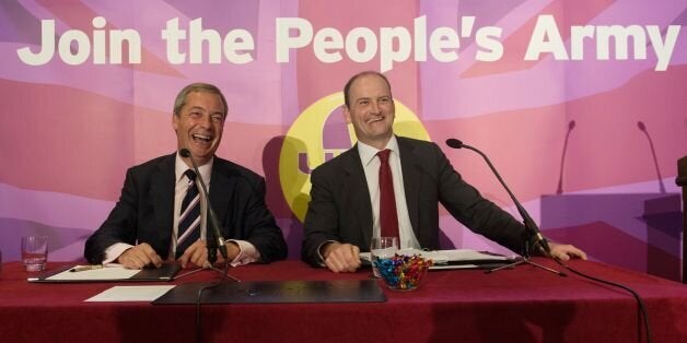 UKIP leader Nigel Farage (left) with Douglas Carswell during a press conference in central London where the Conservative MP defected to his party today.