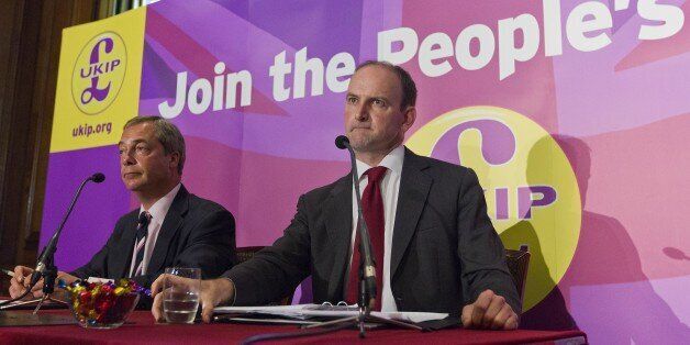 Former British Conservative Party MP Douglas Carswell (R) addresses a press conference in central London on August 28, 2014, with UKIP Party leader Nigel Farage (L). British MP Douglas Carswell dealt a heavy blow to Prime Minister David Cameron on Thursday as he announced he was to leave the Conservative Party and join the UK Independence Party (UKIP). AFP PHOTO / JUSTIN TALLIS (Photo credit should read JUSTIN TALLIS/AFP/Getty Images)