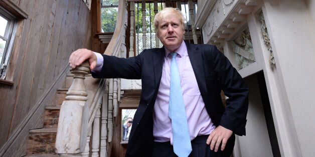 The Mayor of London Boris Johnson looks around a double decker caravan with a 'stately home' style interior during his visit to Sutton House in Hackney, north London.